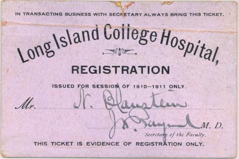 Purple colored medical ticket with black lettering dated 1910-1911.