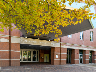 Fromt entrance of Strauss Library in the fall.
