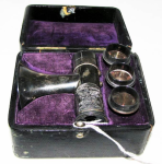 Mayer & Metzler Brunton Auriscope in black case with purple velvet inside lining.