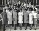 A group photo of the University of Colorado's Class of 1967 Physical Therapy students. LaRae Kemp is in the front row, third from the right in a geometric patterned knee length dress and black heels.