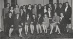Black-and-white group portrait of the women in the sophomore honor society, The Lantern, at Mississippi State College for Women in 1947. The women are primarily dressed in dark skirt suits.
