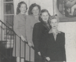 Black and white photograph of the officers of the Classical Club and Eta Sigma Phi. Four women standing in a line on a staircase, dressed in mid-20th-century formal attire.