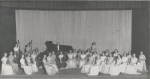 Formal group portrait of the Mississippi State College for Women symphony orchestra. Circa 1946.