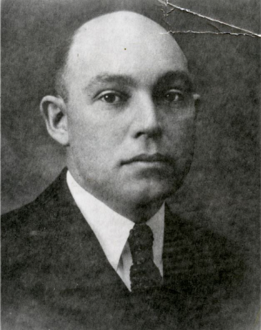 Headshot of Dr. Charles Meader in black and white