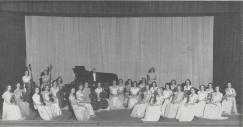 Formal group portrait of the Mississippi State College for Women symphony orchestra. Circa 1946.