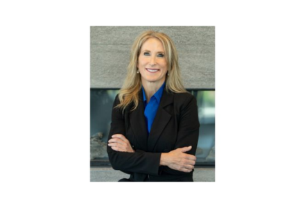 Dr. Kathleen Flarity wearing a blue blouse and black blazer.