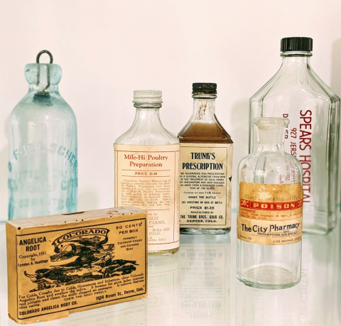 Old medicine bottles from the mid-19th and early-20th centuries.