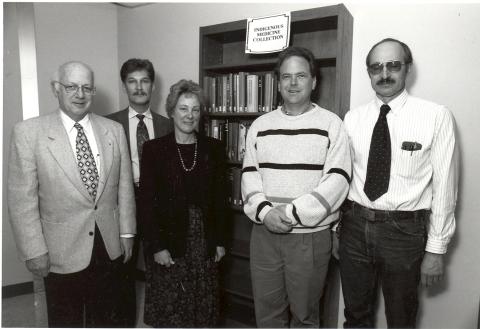 Henry Strauss, Rick Forsman, Pat Nelson, and two members of the Denison Library Advisory Committee standing in front of the newly created Strauss-Wisneski Collection.
