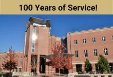 Strauss Library in the fall with 100 years of service text