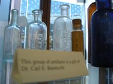 Display of artifacts including old medicine bottles