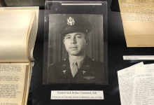Archival display of Dr. Comstock photo and items from during and after WWII.