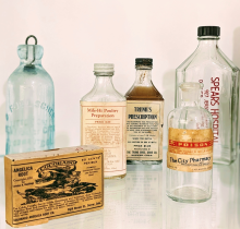 Old medicine bottles from the mid-19th and early-20th centuries.