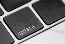Computer keyboard with key marked update.