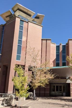 The front entrance of Strauss Library on a fall day.